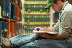 Student studies in a library